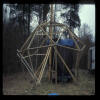 Beginning of geodesic frame for dome; winched up central pole and built from top down (by myself!)