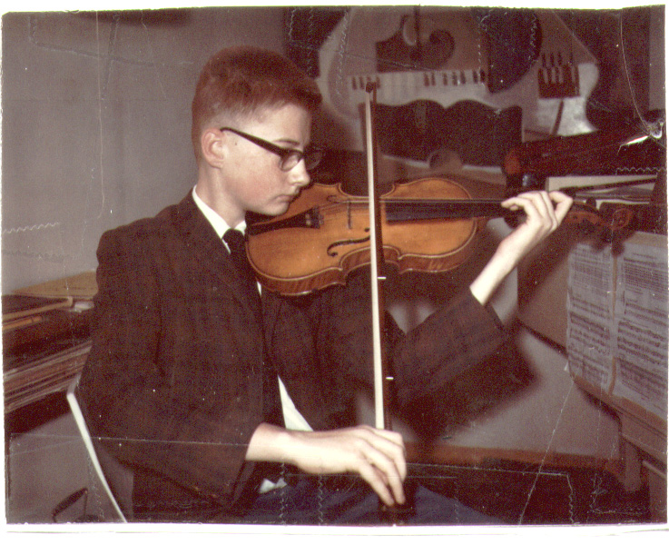 Bill playing violin at age 11